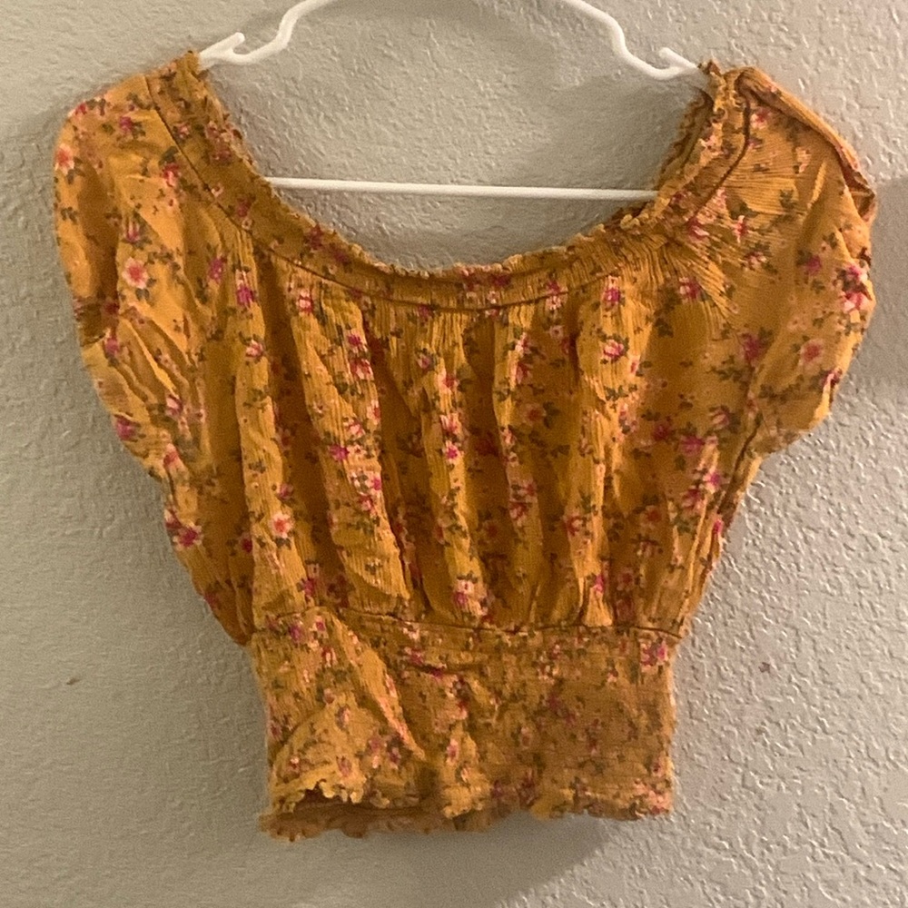 Yellow blouse with pink floral accents